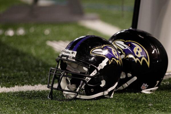 A pair of Baltimore Ravens helmets sit on the sidelines during the Ravens game against the Washington Redskins at M&T Bank Stadium in Baltimore, Md., on Aug. 25, 2011. (Rob Carr/Getty Images)