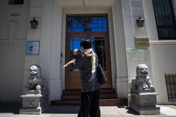 A person stands in front of the Consulate General of the People's Republic of China in San Francisco, California on July 23, 2020. (Philip Pacheco/AFP via Getty Images)
