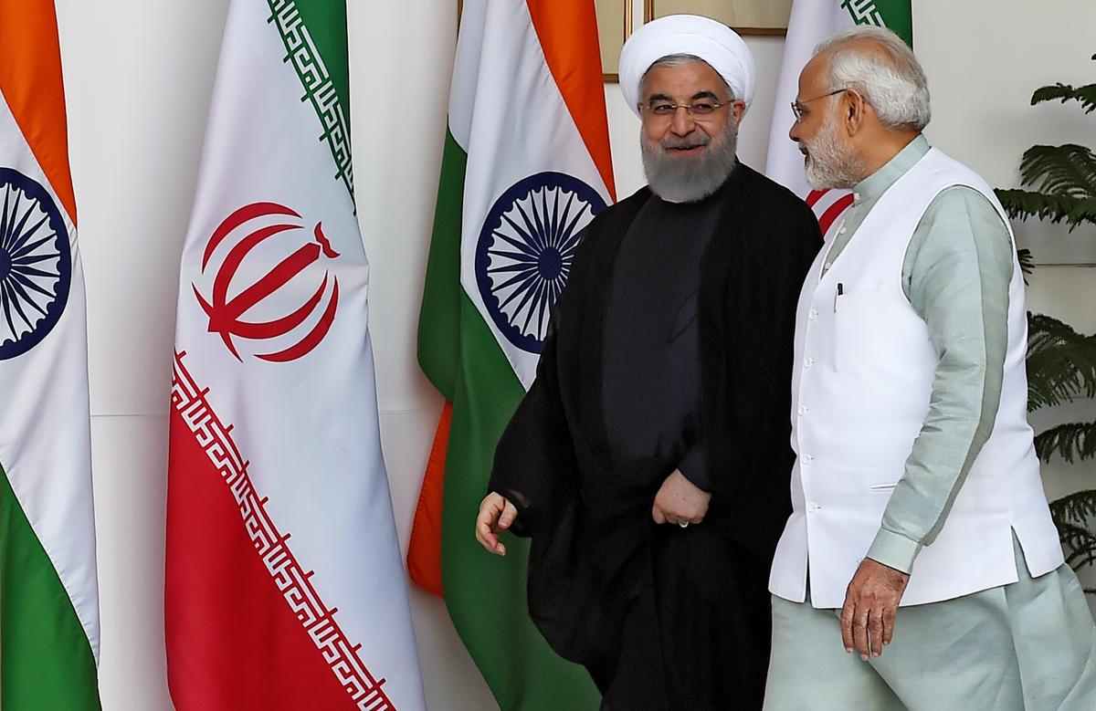 Iranian President Hassan Rouhani (L) and Indian Prime Minister Narendra Modi arrive for a meeting at Hyderabad house in New Delhi on February 17, 2018. (MONEY SHARMA/AFP via Getty Images)