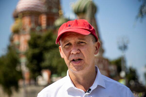 Valery Tsepkalo, a former ambassador to the United States and founder of a successful hi-tech park, speaks during his interview with the Associated Press near Red Square in Moscow, Russia, Tuesday, July 28, 2020, with St. Basil's Cathedral and Spasskaya Tower in the background. Valery Tsepkalo who fled to Russia after being denied a ballot spot in next month’s presidential election says he may not be able to return home if President Alexander Lukashenko wins another term. He fled to Russia last week and said he had received tips that his arrest was imminent. (Alexander Zemlianichenko/AP Photo)