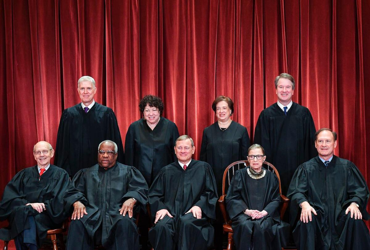 Standing from left: Associate Justice Neil Gorsuch, Associate Justice Sonia Sotomayor, Associate Justice Elena Kagan and Associate Justice Brett Kavanaugh.Seated from left to right, bottom row: Associate Justice Stephen Breyer, Associate Justice Clarence Thomas, Chief Justice John Roberts, Associate Justice Ruth Bader Ginsburg, and Associate Justice Samuel Alito. (Mandel Ngan/AFP via Getty Images)