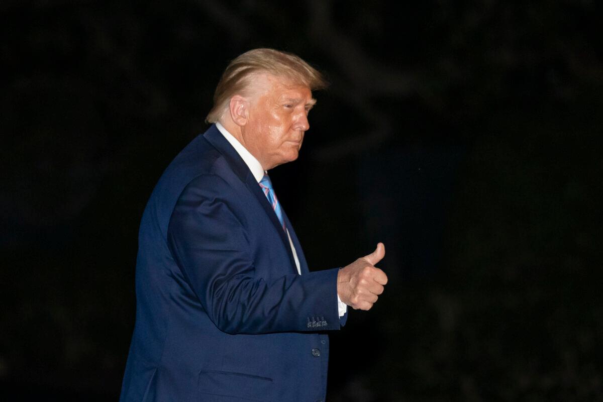 President Donald Trump gives a thumbs-up as he walks from Marine One as he returns to the White House from Texas, in Washington on July 29, 2020. (Alex Brandon/AP Photo)