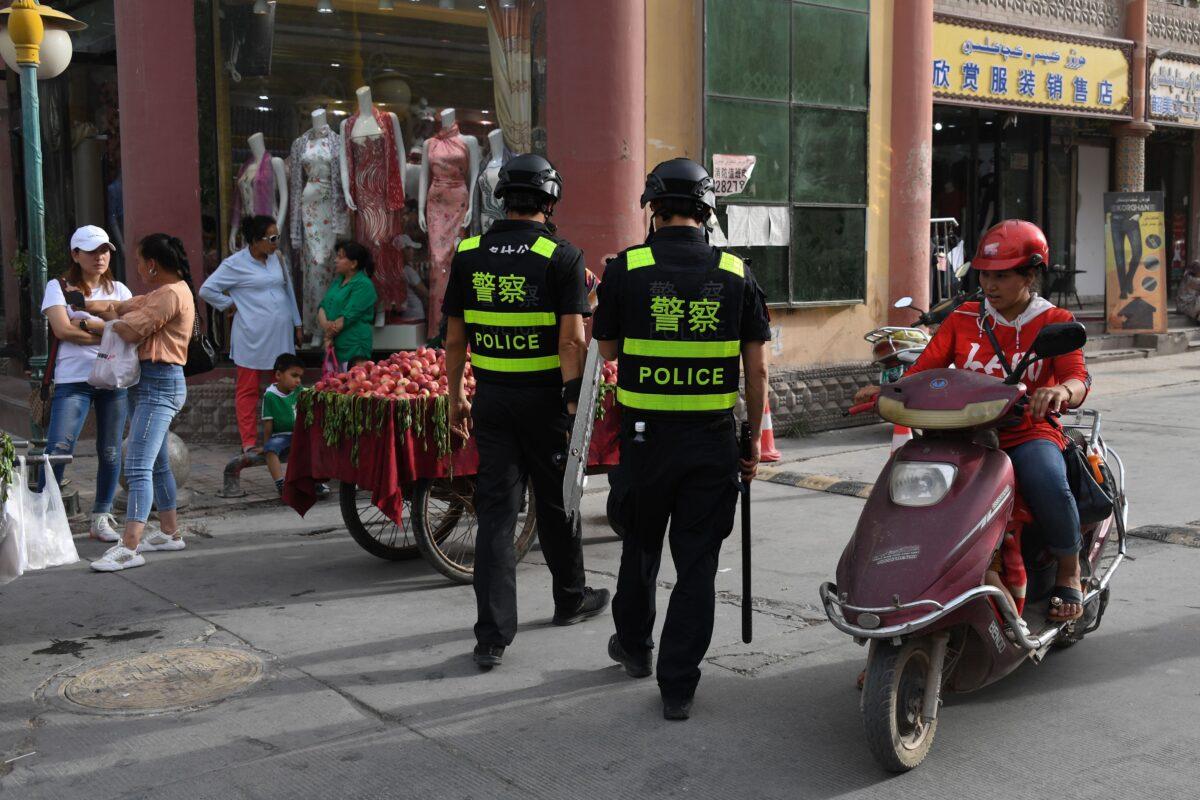 Police officers patrolling in Kashgar, in China's western Xinjiang region, on June 4, 2019. (Greg Baker/AFP via Getty Images)