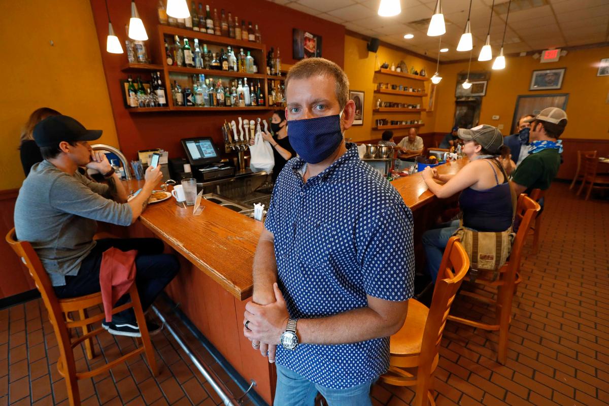 In one of the first decisions issued on that question, a Michigan state judge sided with an insurer's rejection of a claim for $650,000 for two months of losses that Gavrilides said he suffered at two restaurants. (Paul Sancya/AP Photo)