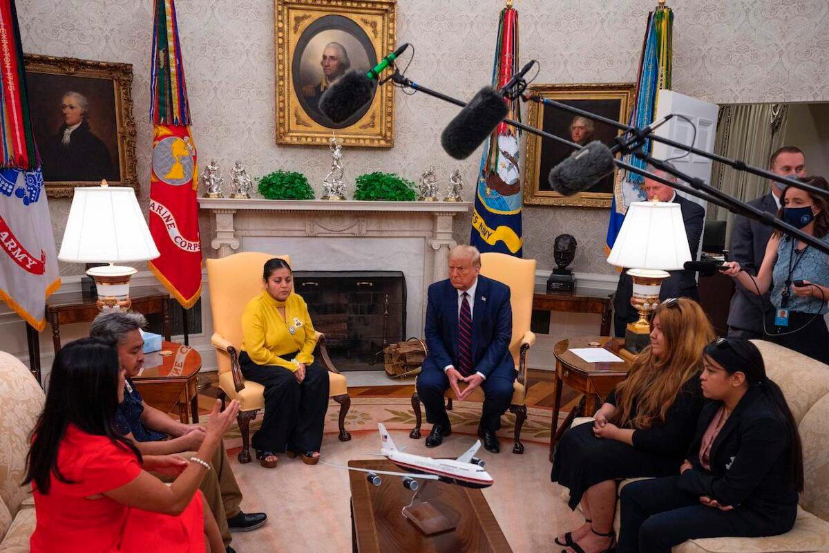 President Donald Trump speaks with Gloria Guillen (3rd L), the mother of Vanessa Guillen, a Fort Hood soldier found dead after disappearing from Fort Hood, Texas, as well as her family and lawyer in the Oval Office of the White House in Washington on July 30, 2020. (Jim Watson/AFP via Getty Images)