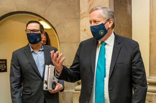 White House chief of staff Mark Meadows (R) and Treasury Secretary Steven Mnuchin arrive at the office of House Speaker Nancy Pelosi (D-Calif.) at the Capitol in Washington on Aug. 1, 2020. (Manuel Balce Ceneta/AP Photo)