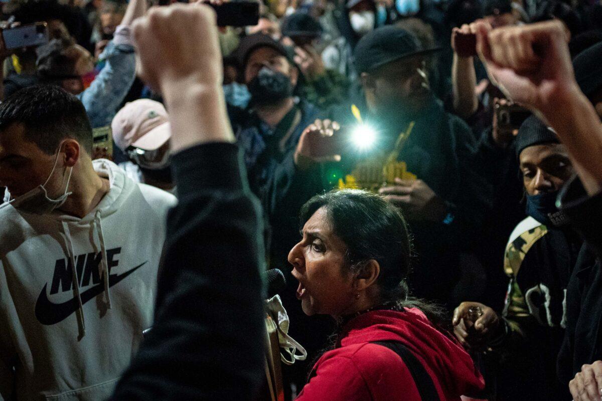 Seattle City Councilmember Kshama Sawant speaks to demonstrators outside the Seattle Police Department's East Precinct in Seattle, Wash., on June 8, 2020. (David Ryder/Getty Images)