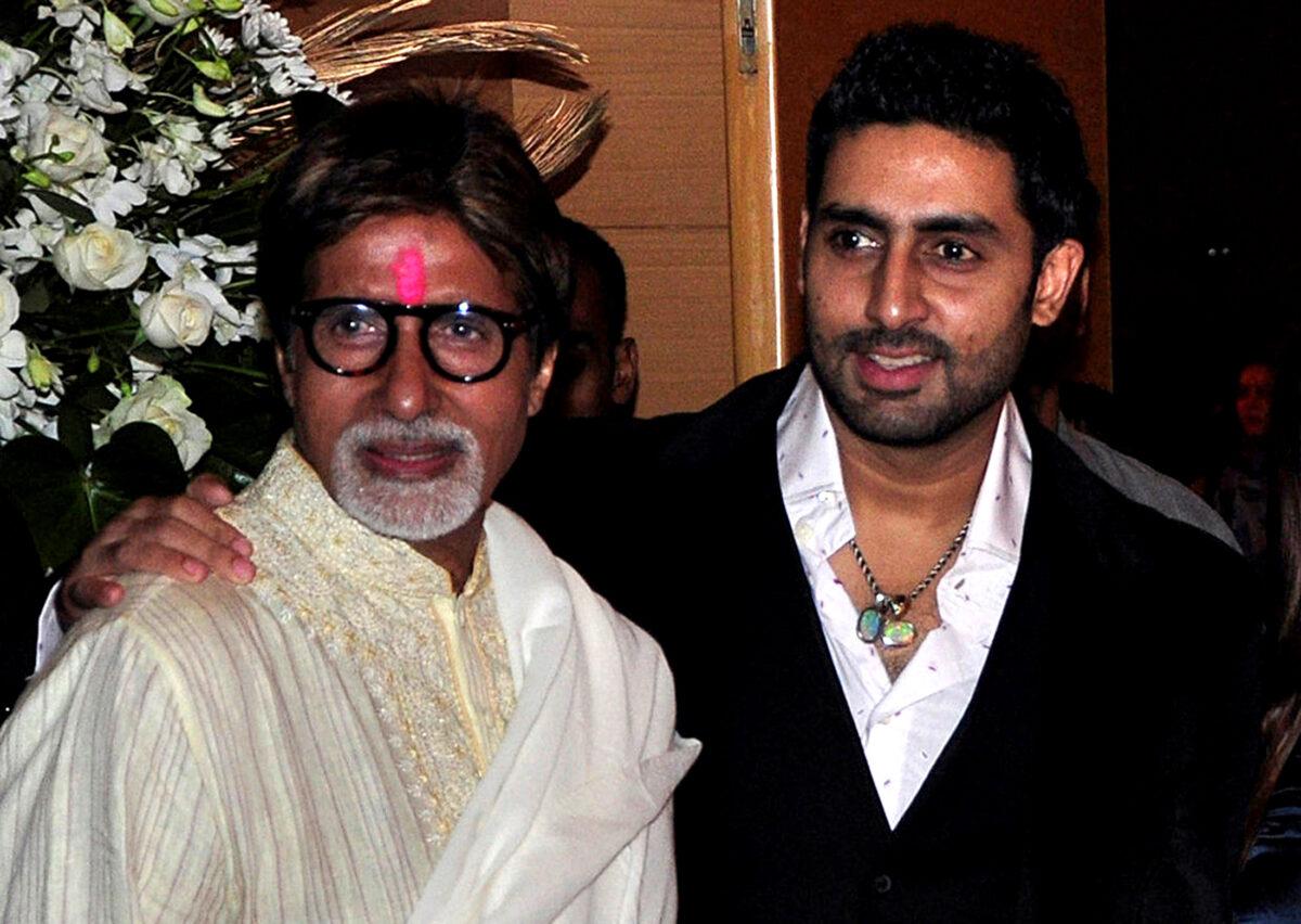 Bollywood actors Amitabh Bachchan (L) and his son Abhishek Bachchan pose for a picture during a party of a new Bollywood production company in Mumbai, on Feb. 28, 2010. (Manav Manglani/Reuters)