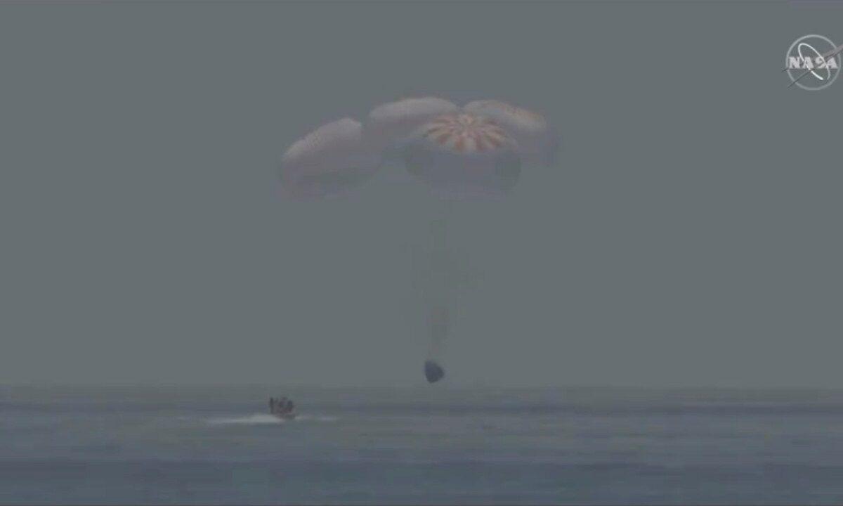 A capsule with NASA astronauts Robert Behnken and Douglas Hurley splashes down in the Gulf of Mexico, on Aug. 2, 2020. (NASA/Handout via Reuters)