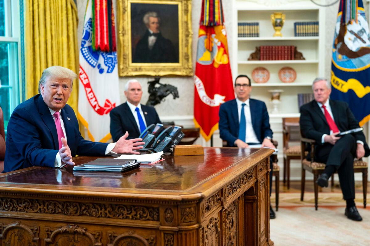 President Donald Trump talks to reporters while hosting (2nd L-R) Vice President Mike Pence, Treasury Secretary Steven Mnuchin, White House Chief of Staff Mark Meadows and Republican congressional leaders in the Oval Office at the White House on July 20, 2020. (Doug Mills-Pool/Getty Images)