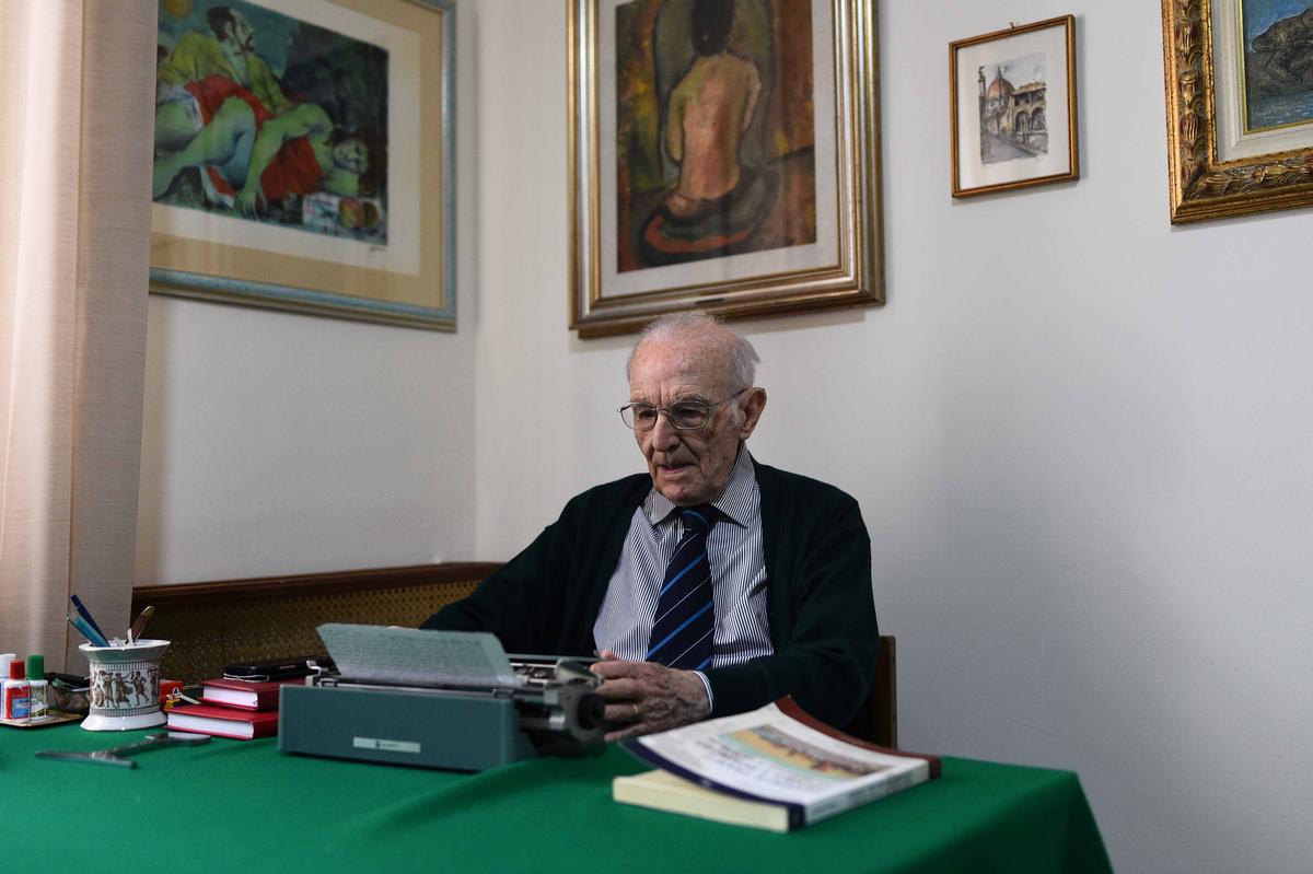 Giuseppe Paterno uses his typewriter as he studies for an exam at his home in Palermo, Italy, Nov. 4, 2019. (Guglielmo Mangiapane/REUTERS)