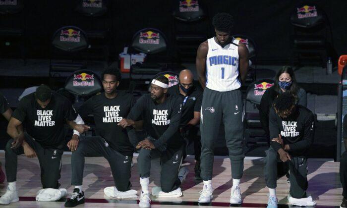 First NBA Player to Stand for National Anthem Goes Down With ACL Injury