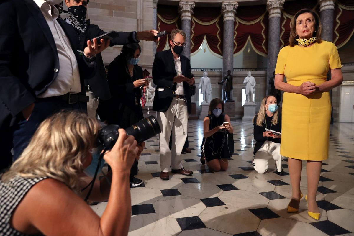 Speaker of the House Nancy Pelosi (D-CA) and Senate Minority Leader Charles Schumer (D-NY) talk with reporters in Statuary Hall in the U.S. Capitol in Washington on Aug. 3, 2020. (Chip Somodevilla/Getty Images)