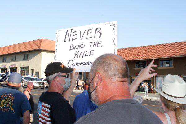 Counterprotesters stand along Yucaipa Boulevard as a protest in support of Black Lives Matter proceeds in Yucaipa, Calif., on Aug. 1, 2020. (Brad Jones/The Epoch Times)