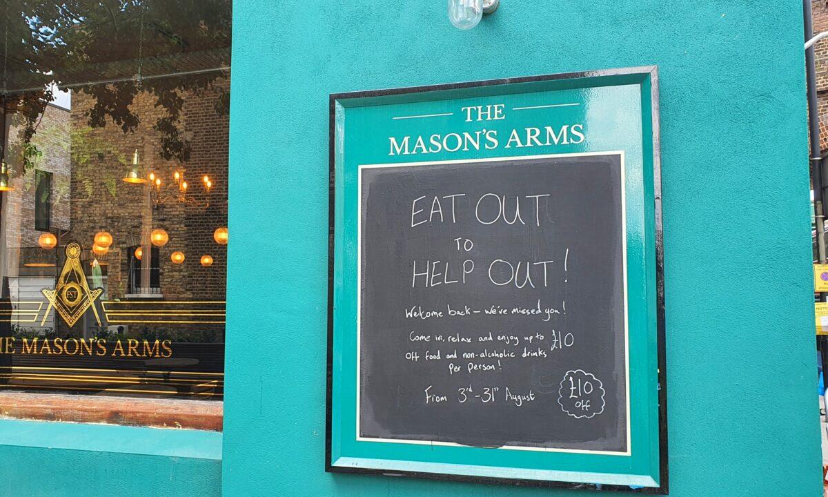 A sign advertising up to 10 pounds off for food and non-alcoholic drinks outside a pub, in London, Britain, on Aug. 3, 2020. (Lily Zhou/The Epoch Times)