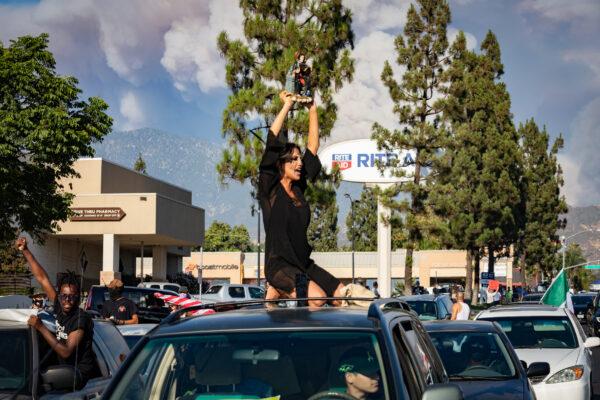 A protester chants "Death to white supremacists" in Yucaipa, Calif., on Aug. 1, 2020. (John Fredricks/The Epoch Times)