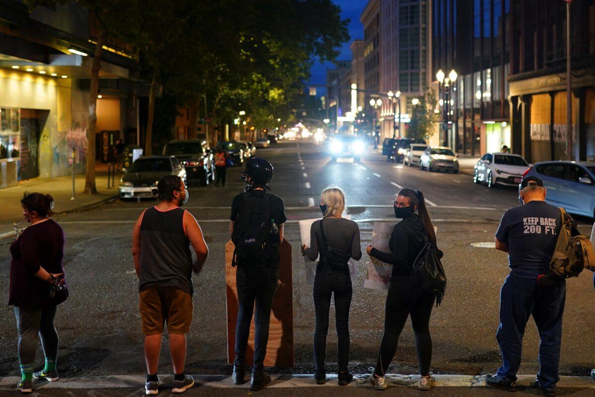 A line of protesters blocks the street in front of the Mark O. Hatfield Courthouse during a Black Lives Matter protest in Portland, Ore., on Aug. 2, 2020. (Nathan Howard/Getty Images)