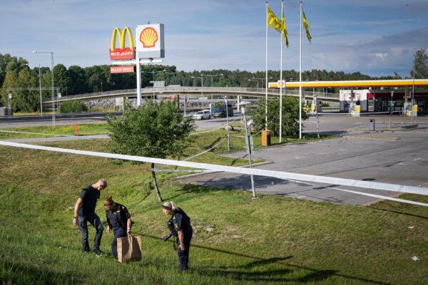 <span style="font-family: 'Verdana',sans-serif; color: #2c2c2c;">Police work at the site where a 12-year-old girl was shot and killed near a petrol station in Botkyrka, south of Stockholm, Sweden, onAug. 2, 2020. (Naina Helén Jåma/TT via AP Photo)</span>