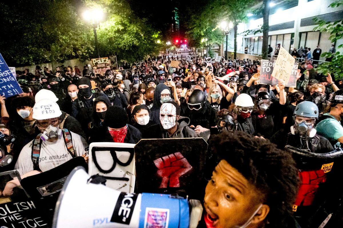 Black Lives Matter protesters march through Portland, Ore., after rallying outside the Mark O. Hatfield United States Courthouse in Portland, Ore., on Aug. 2, 2020. (Noah Berger/AP Photo)