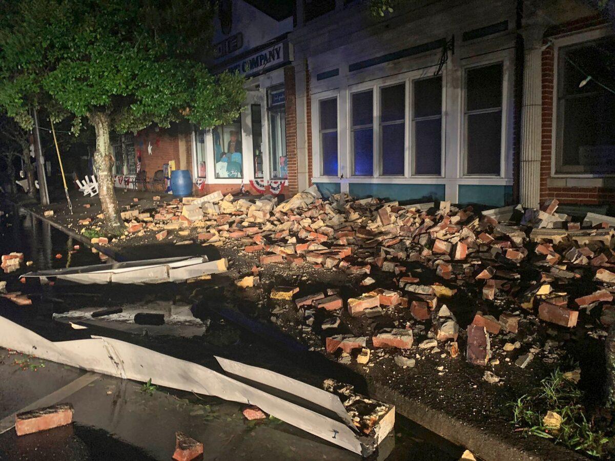 Debris covers the sidewalk in Southport, as hurricane Isaias moved through North Carolina, early on Aug. 4, 2020. (WECT-TV via AP)
