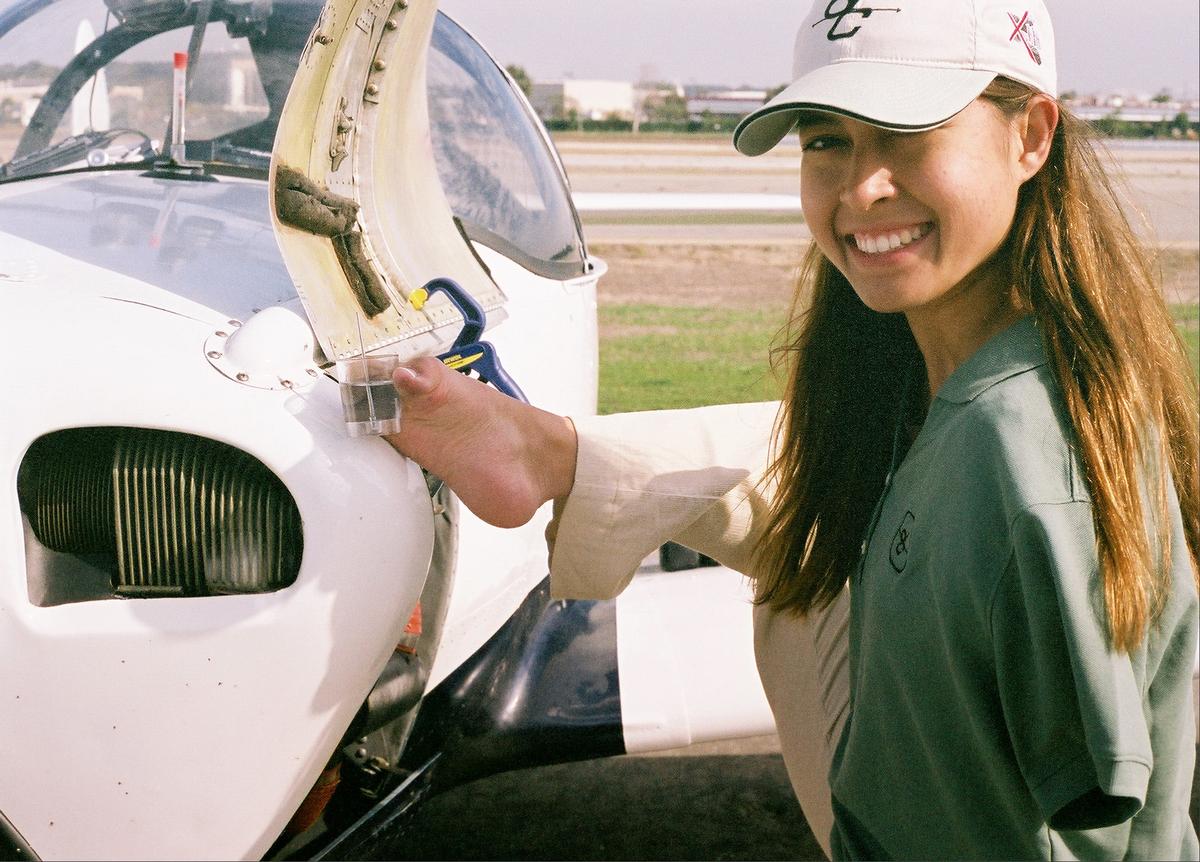 Checking aircraft fuel levels (Courtesy of <a href="https://www.jessicacox.com/">Jessica Cox</a>)