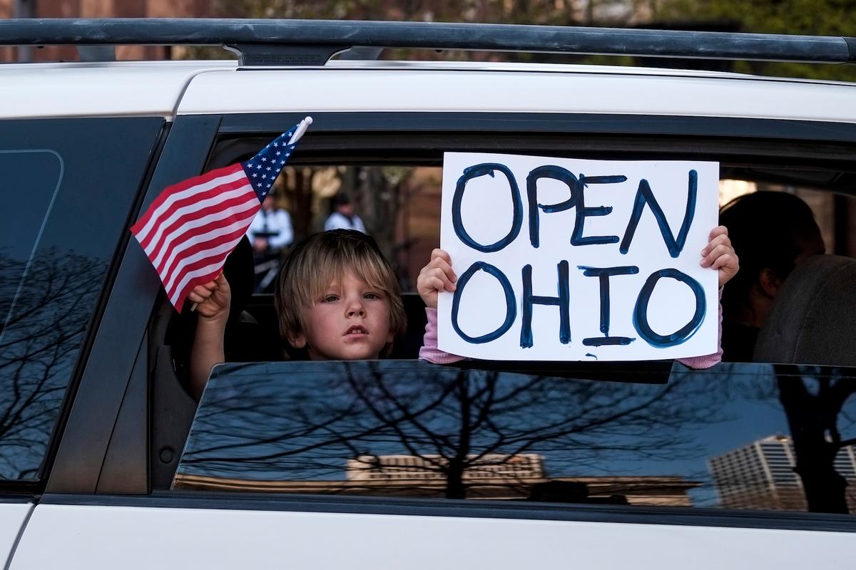 Protesters gather at the Ohio Statehouse to protest the stay-at-home order in Columbus, Ohio, on April 20, 2020. (Matthew Hatcher/Getty Images)