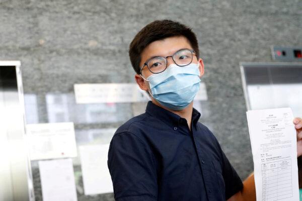 Pro-democracy activist Joshua Wong registers as a candidate for the upcoming Legislative Council election in Hong Kong, China, on July 20, 2020. (Tyrone Siu/Reuters)