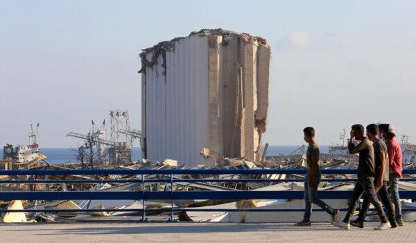 People walk near the site of Tuesday's blast in Beirut's port area, Lebanon on Aug. 6, 2020. (Aziz Taher/Reuters)