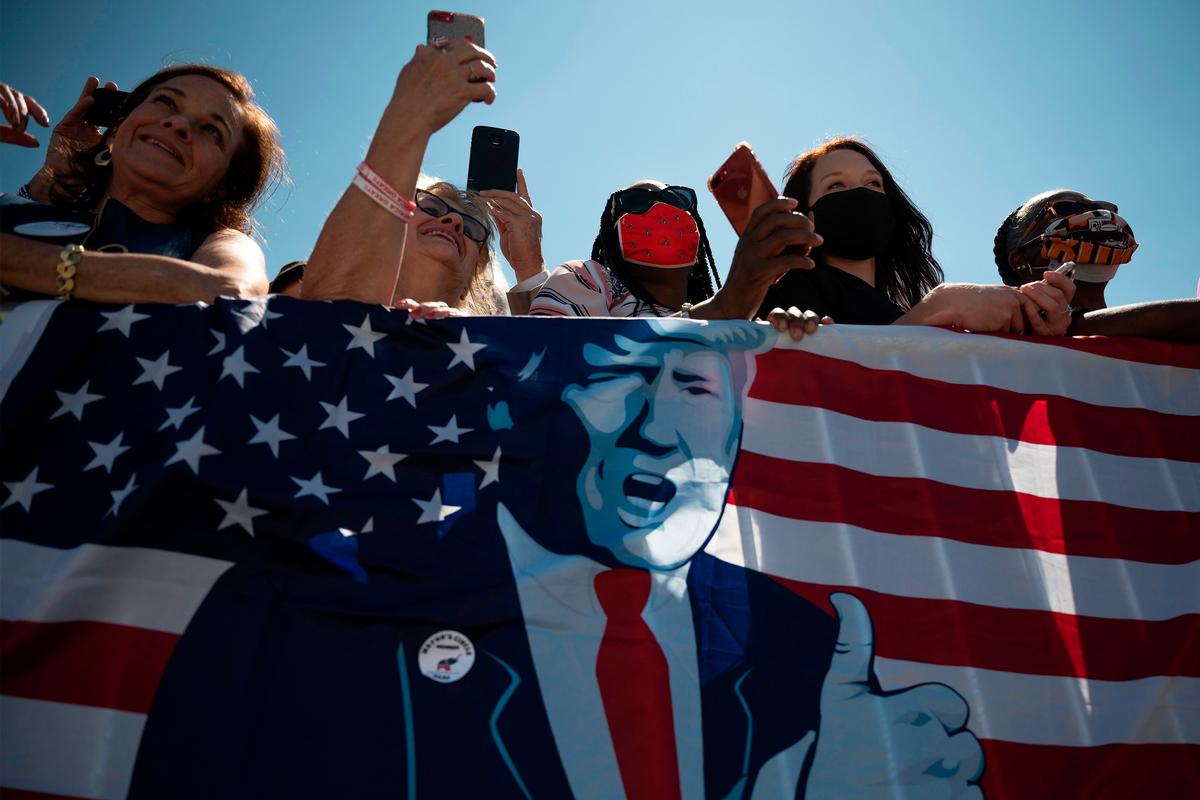 Supporters listen as President Donald Trump talks about economic prosperity, at Burke Lakefront Airport in Cleveland, Ohio, on Aug. 6, 2020. (Jim Watson/AFP via Getty Images)