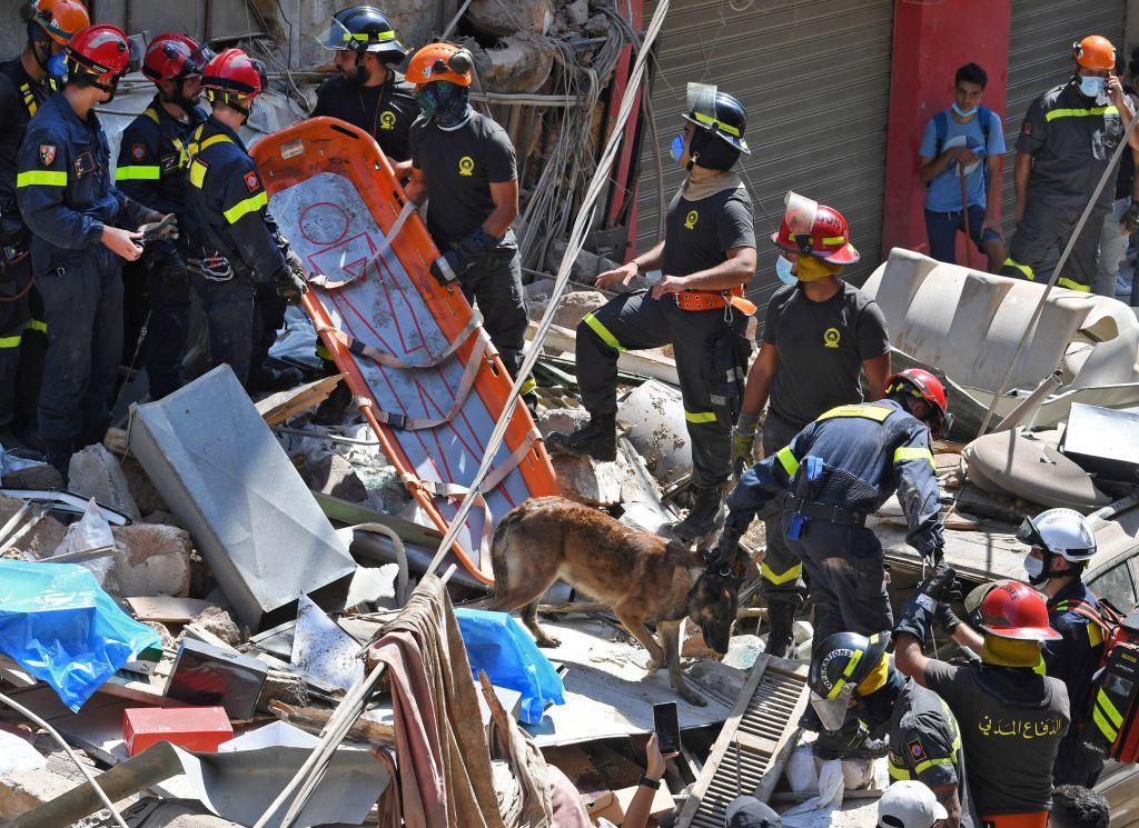 Lebanese and French rescuers search for victims or survivors amidst the rubble of a building in Beirut's Gemayzeh neighborhood on Aug. 6. (AFP via Getty Images)