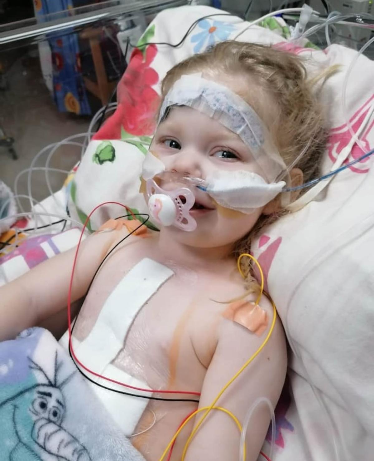 Lacey-Janet Ambler at her open-heart surgery in April. (Caters News)