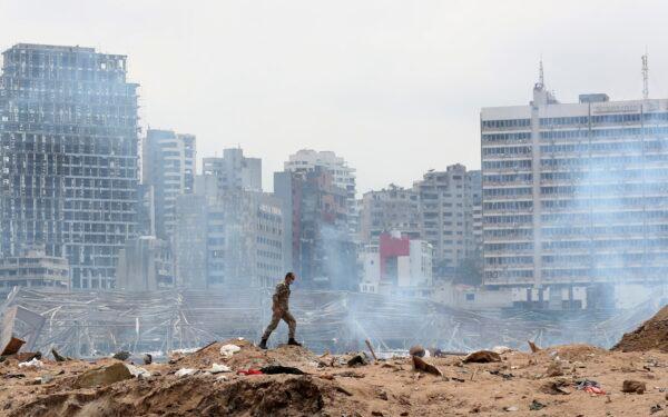 A soldier walks at the devastated site of the explosion in the port of Beirut, Lebanon, on Aug.6, 2020. (Thibault Camus, Pool/AP Photo)