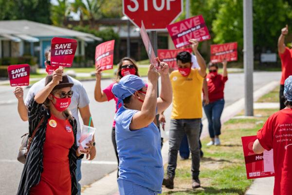 Nurses call for better protection against COVID-19 as part of a nationwide protest outside Kindred Hospital Westminster in Westminster, Calif., on Aug. 5, 2020. (John Fredricks/The Epoch Times)