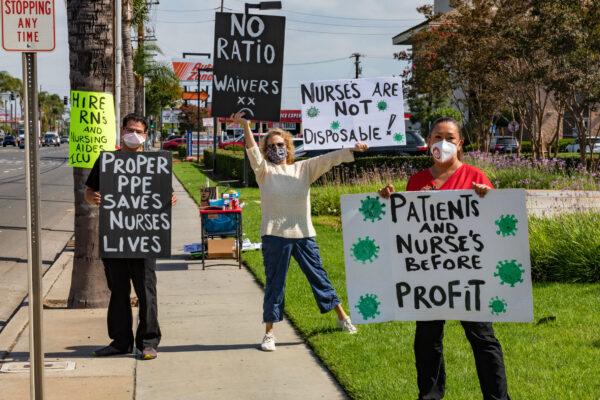 Nurses Wallace Cunningham , left, Shannon Cook, middle, and Karen Rodriguez, right, hold signs at a protest calling for better protection against COVID-19 at South Coast Global Medical Center in Santa Ana, Calif., on Aug. 5, 2020. (John Fredricks/The Epoch Times)