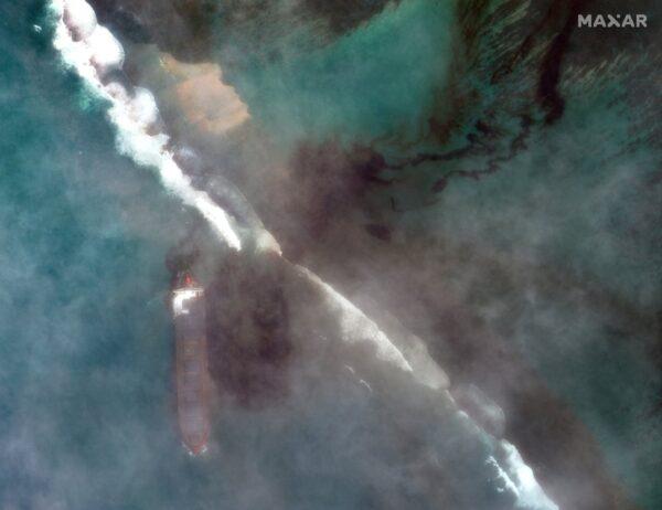 In this satellite image provided by 2020 Maxar Technologies on Aug. 7, 2020, an aerial view of oil leaking from the MV Wakashio, a bulk carrier ship that recently ran aground off the southeast coast of Mauritius. (2020 Maxar Technologies via AP)