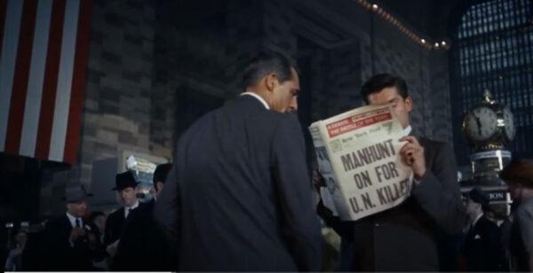 Roger Thornhill (Cary Grant) glimpses a headline that tells him that he is wanted for murder, in “North by Northwest.” (Metro-Goldwyn-Mayer)