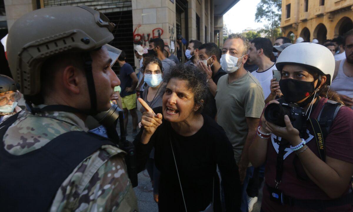 A woman shouts at a member of the army during anti-government demonstrations in Beirut, Lebanon, on August 8, 2020. (Marwan Tahtah/Getty Images)