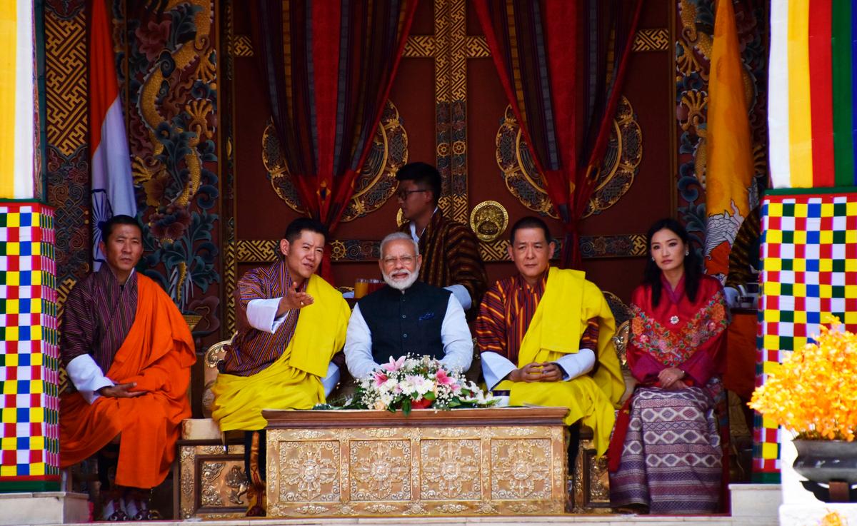 Indian Prime Minister Narendra Modi (C) sits next to Bhutan's King Jigme Khesar Namgyel Wangchuck (2L), the Fourth Druk Gyalpo (2R), Bhutan's Queen Jetsun Pema (R) and Bhutan's Prime Minister Lotay Tshering (L) while watching a cultural performance at the Tashichhodzong during Modi's two-day visit to Bhutan, on Aug. 18, 2019. (Upasana Dahal/AFP via Getty Images)