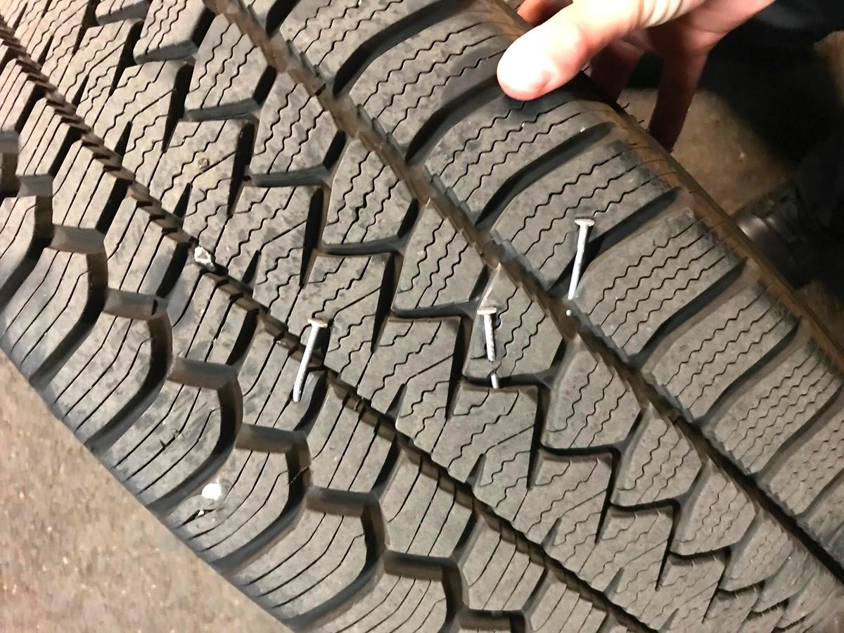 A police vehicle tire that suffered nail punctures damage in a handout photo released on Aug. 8, 2020. (Portland Police Bureau via AP)