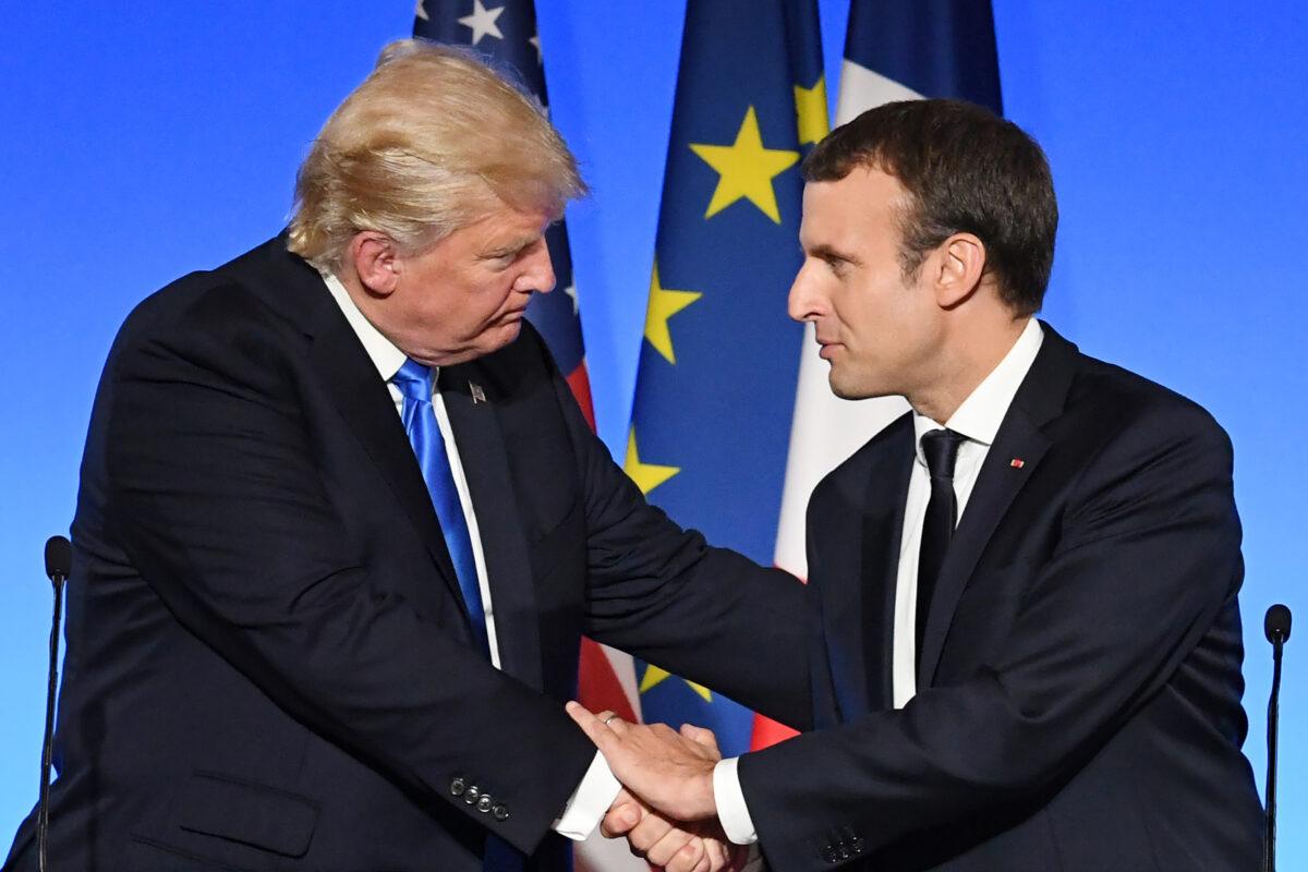 U.S. President Donald Trump (L) and French President Emmanuel Macron (R) shake hand at the end of a press conference following meetings at the Elysee Palace in Paris, on July 13, 2017. (Alain Jocard/AFP via Getty Images)