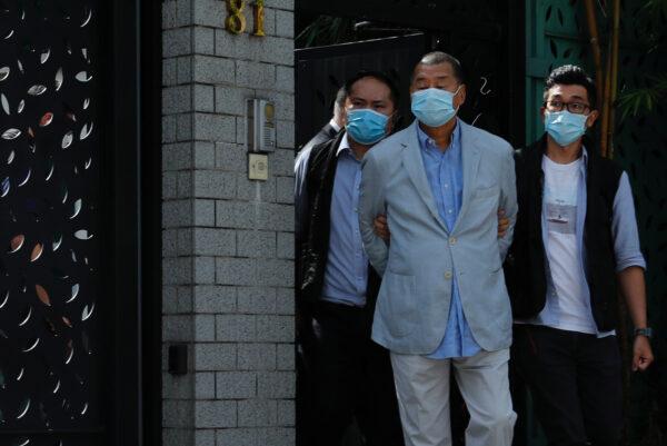 Media mogul Jimmy Lai Chee-ying, founder of Apple Daily (C), is detained by the national security unit in Hong Kong on Aug. 10, 2020. (Tyrone Siu/Reuters)