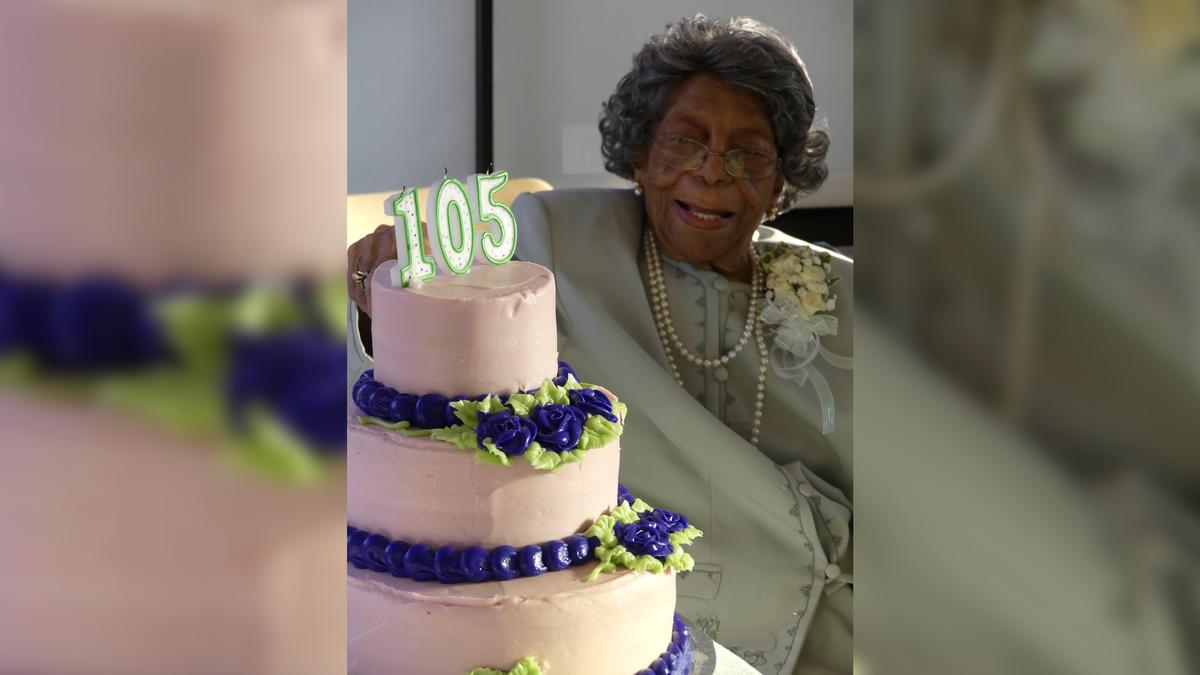 Venus Tucker with her cake on her 105th birthday. (Courtesy of Our Lady of the Valley)