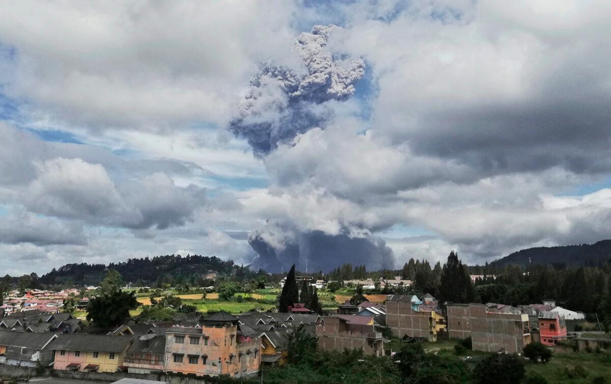 Mount Sinabung spews volcanic materials into the air as it erupts, in Karo, North Sumatra, Indonesia, on Aug. 10, 2020. (Sugeng Nuryono/AP Photo)