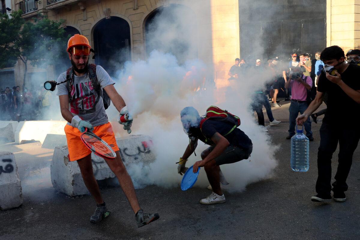 Demonstrators take part in a protest following the blast in Beirut, Lebanon, on Aug. 10, 2020. (Alkis Konstantinidis/Reuters)