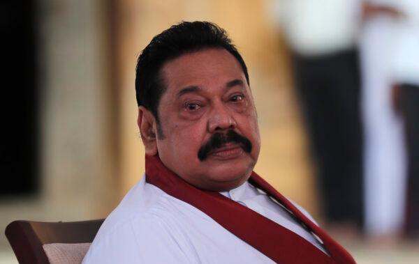 Sri Lanka’s former President Mahinda Rajapaksa, waits to be sworn in as the prime minister at Kelaniya Royal Buddhist temple in Colombo, Sri Lanka on Aug. 9, 2020. (AP Photo/Eranga Jayawardena)