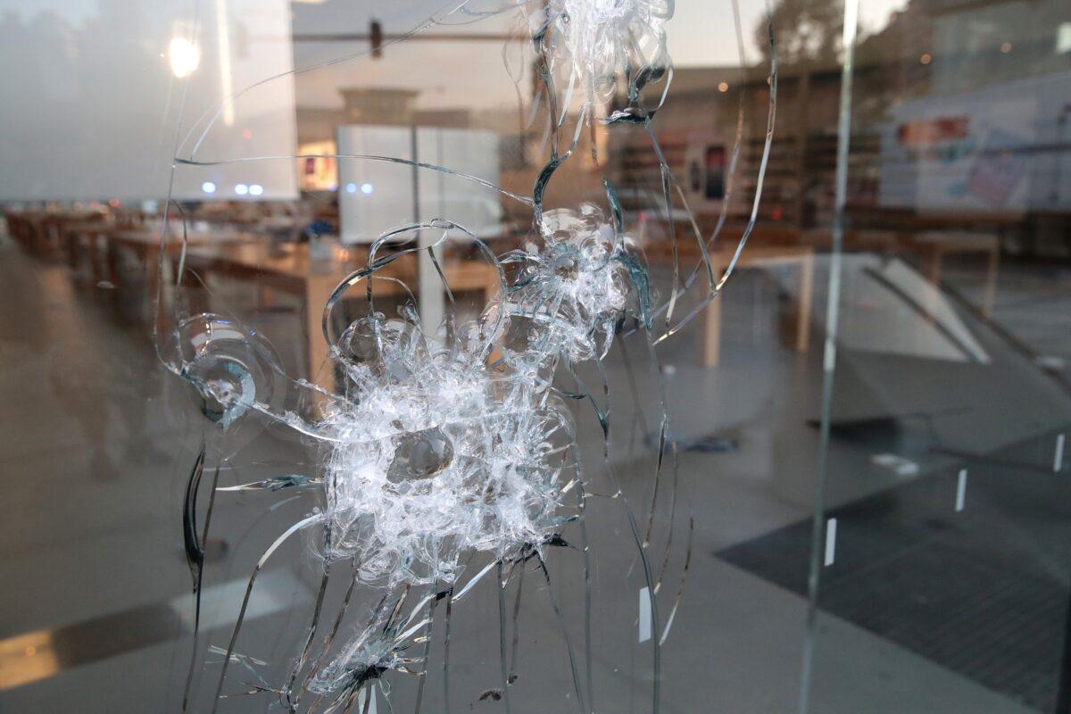 A broken storefront window in Chicago on Aug. 10, 2020. (Scott Olson/Getty Images)