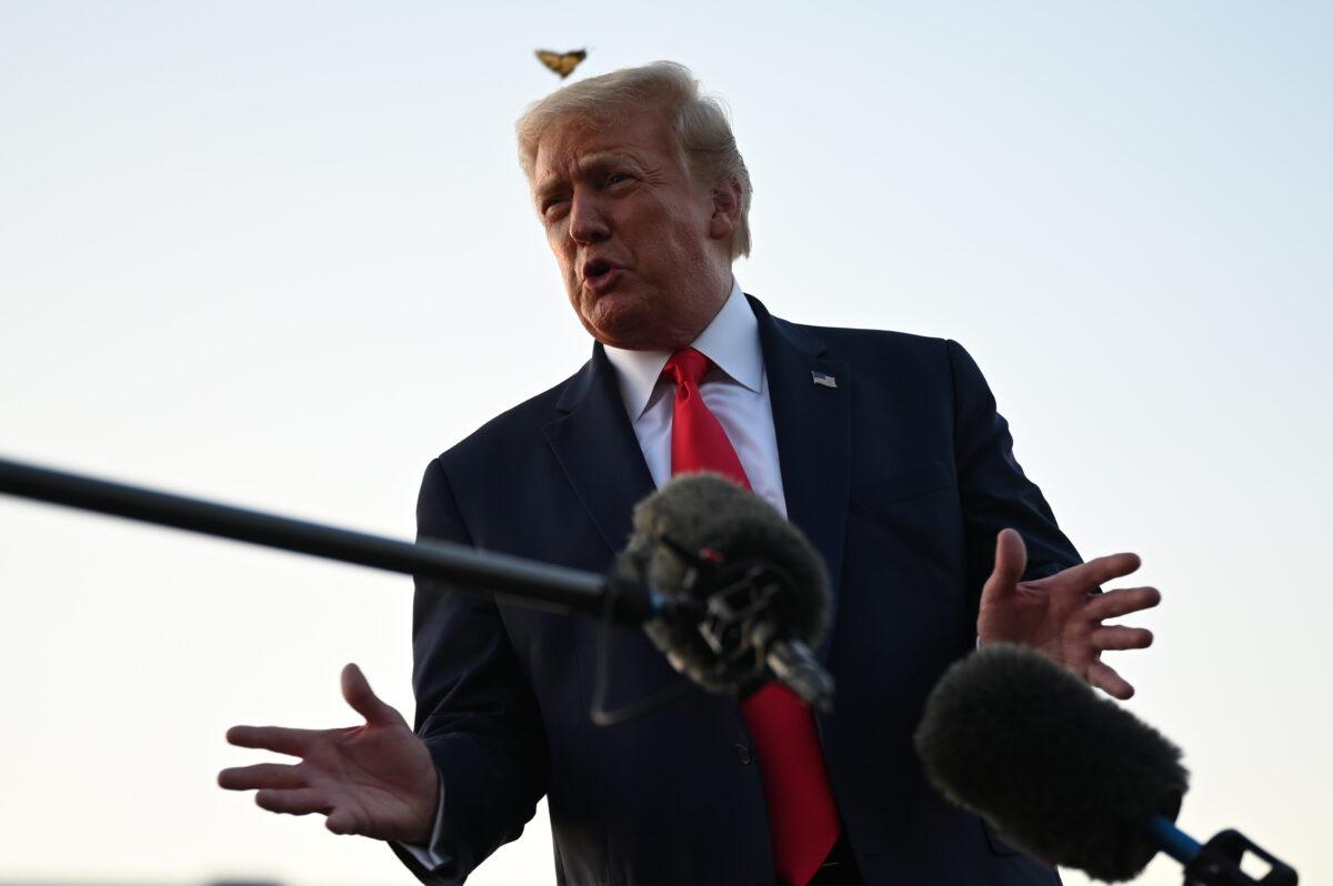 President Donald Trump takes questions from the media on the tarmac at Morristown Municipal Airport in Morristown, New Jersey, on Aug. 9, 2020. (Jim Watson/AFP via Getty Images)