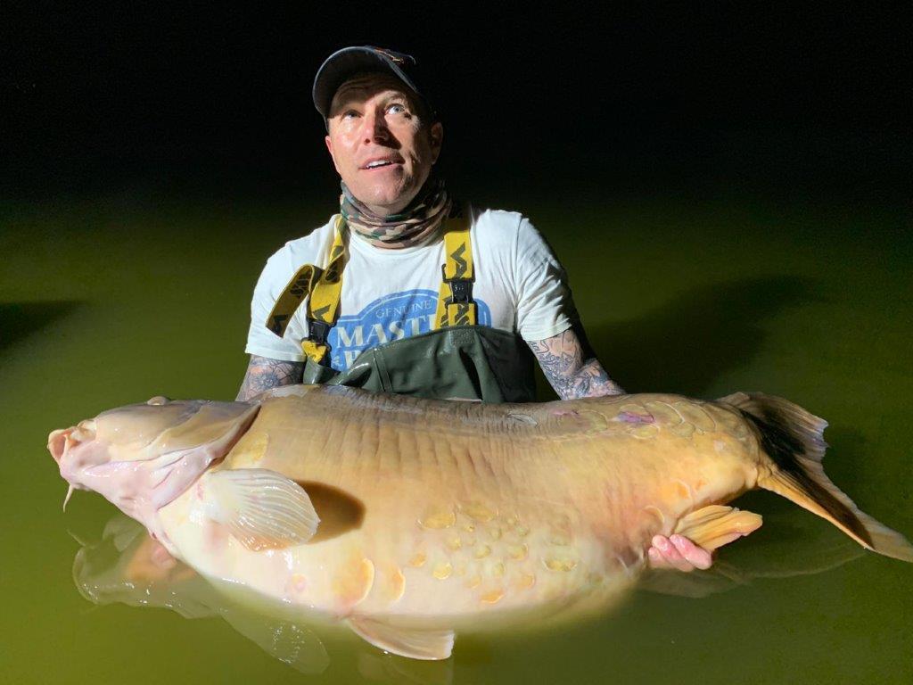 Davidson lifts the 101-pound carp at Euro Aqua fishing club in Nemesvita, Hungary, in September 2019. (Courtesy of Martin Davidson)