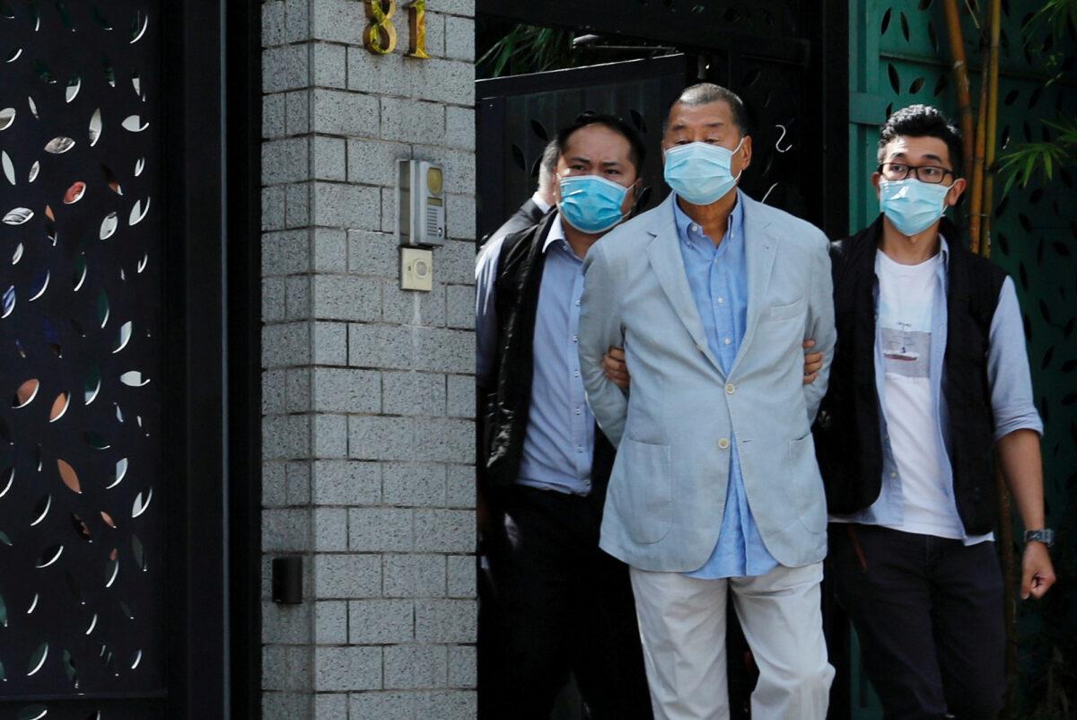 Media mogul Jimmy Lai Chee-ying, the founder of Apple Daily, is detained by the national security unit in Hong Kong, China, on Aug. 10, 2020. (Tyrone Siu TPX Images of the day/Reuters)