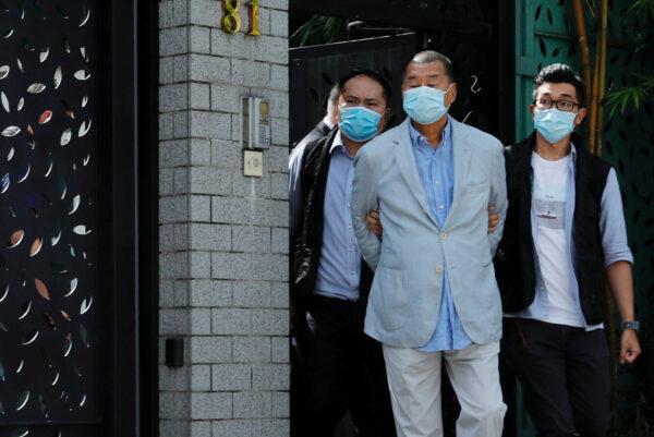 Media mogul Jimmy Lai Chee-ying, founder of Apple Daily is detained by the national security unit in Hong Kong, China, on Aug. 10, 2020. (Tyrone Siu TPX Images of the day/Reuters)